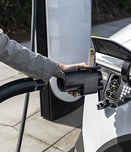 The Hyundai NACS adapter being plugged into a 2024 IONIQ 5 in Fountain Valley, Calif. on March 15, 2025.