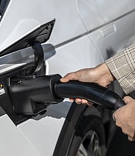 The Hyundai NACS adapter being plugged into a 2024 IONIQ 5 in Fountain Valley, Calif. on March 15, 2025.