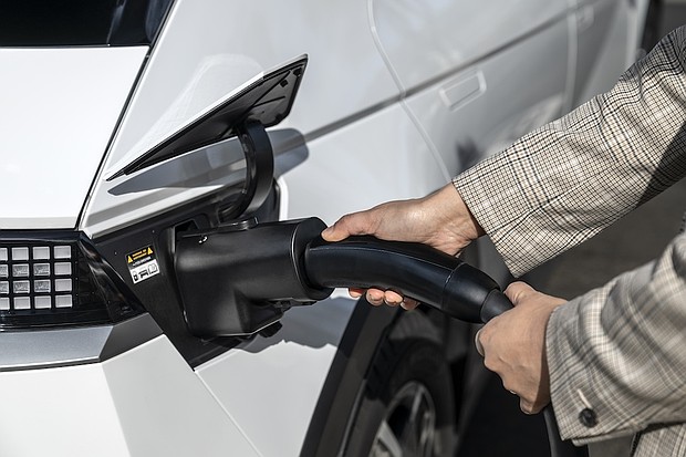 The Hyundai NACS adapter being plugged into a 2024 IONIQ 5 in Fountain Valley, Calif. on March 15, 2025.