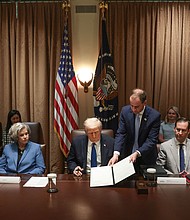 US President Donald Trump sits with (L-R) Warren Stephens, Chief of Staff Susie Wiles, Sergio Gor, assistant to President Donald Trump and Director of the Presidential Personnel Office, and Charles Kushner during an Ambassador Meeting in the Cabinet Room of the White House on March 25 in Washington, DC.
Mandatory Credit:	Win McNamee/Getty Images via CNN Newsource