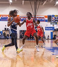 Justin Debrew, from Cosby High School, defends Dennel Douglas, from J.R. Tucker High School at the DTLR Sports 804 All-Star Game on Saturday, March 22, at J.R. Tucker High School. The Blue teams represented players from North Side schools, while the Red teams represented South Side schools.