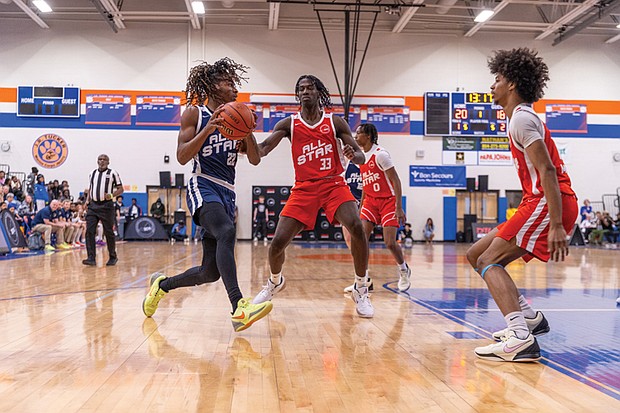 Justin Debrew, from Cosby High School, defends Dennel Douglas, from J.R. Tucker High School at the DTLR Sports 804 All-Star Game on Saturday, March 22, at J.R. Tucker High School. The Blue teams represented players from North Side schools, while the Red teams represented South Side schools.
