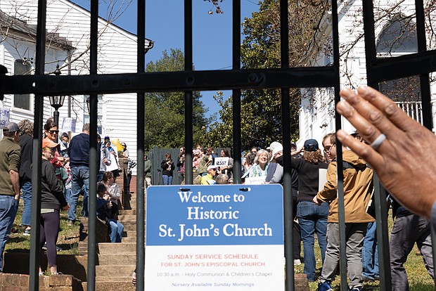 Protesters gather outside St. John’s Church during a reenactment marking the 250th anniversary of Patrick Henry’s iconic revolutionary speech.