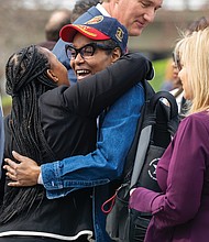 Kay Currie, Women Veterans Liaison, Virginia Department of Veterans Services, hugging Marine Corps and Army veteran, Kai Ellison, during the annual Virginia Women Veterans Week Capstone Event at the Virginia War Memorial on Thursday, March 20. The ceremony featured speeches from state officials and military leaders, with lapel pins awarded to the women veterans in attendance.
