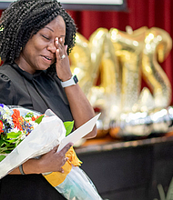 Arainau “Rainy” Neal, principal of Maude Trevvett Elementary School, reacts to the news that she is Henrico County Public Schools’ 2025 REB winner. She was surprised at the school on March 14.