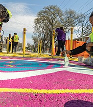 Seventh-grade MLK art students Sariah W. and Brianna T. join city leaders, educators, and
community volunteers in painting a street mural along the 1000 block of Mosby Street on Fri-
day, March 29. The project is part of the Lighter, Quicker, Cheaper (LQC) initiative, led by the
Richmond Department of Public Works and the Office of Equitable Transit and Mobility. LQC
projects — informed by community feedback — focus on improving traffic safety, advancing
transportation equity and creating more accessible streets through quick, low-cost solutions while securing funding for permanent upgrades.