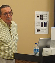 James Vigeant, president of The Ealey Project, speaks during a presentation at the Richmond Public Library on Saturday with members of the Greater Richmond Chapter of the Afro-American Historical Genealogical Society.