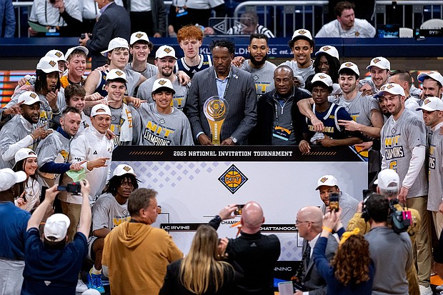 Chattanooga players celebrate the team's victory after the championship game against UC Irvine.
Mandatory Credit:	Doug McSchooler/NCAA Photos/Getty Images via CNN Newsource