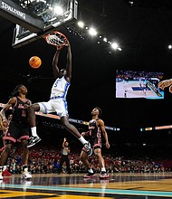 Maluach dunks against the Houston Cougars during the the men's Final Four of March Madness.
Mandatory Credit:	Bob Donnan/Imagn Images/Reuters via CNN Newsource