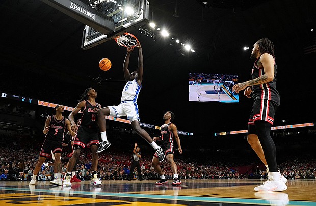 Maluach dunks against the Houston Cougars during the the men's Final Four of March Madness.
Mandatory Credit:	Bob Donnan/Imagn Images/Reuters via CNN Newsource