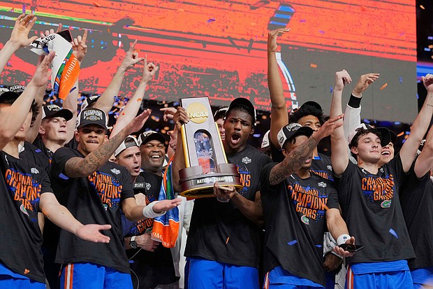 Florida celebrates after beating Houston in the national championship at the Final Four of the NCAA college basketball tournament.
Mandatory Credit:	Eric Gay/AP via CNN Newsource
