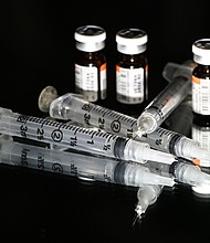 For the first time, two-in-one flu and Covid combination vaccines -- which vaccinate against both Covid-19 and influenza in a single shot -- could be up for FDA action this year.
Mandatory Credit:	Artur Widak/NurPhoto/Getty Images via CNN Newsource