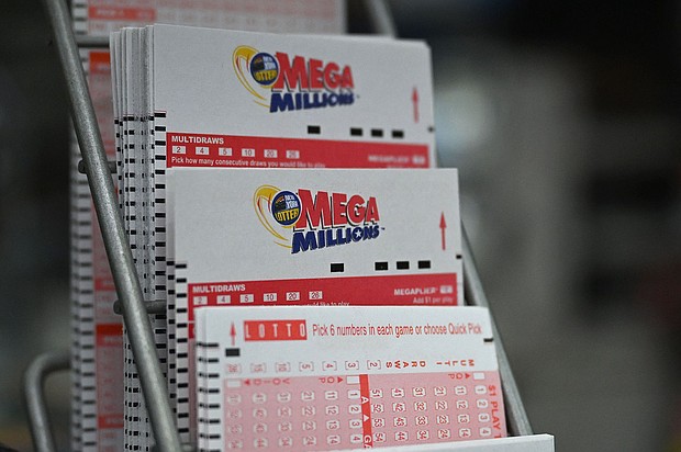 The price of a Mega Millions ticket jumped to $5.
Mandatory Credit:	Angela Weiss/AFP/Getty Images via CNN Newsource