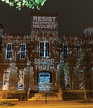 The Black History Museum & Cultural Center of Virginia displayed projections on the Leigh Street side of its building last Wednesday night in honor of Richmond’s 160th Emancipation Day. The exhibit, created by artists Dustin Klein and Alex Criqui of Reclaiming the Monument, featured historical images and text highlighting African American soldiers who served in the First Battalion Virginia Volunteers at the Leigh Street Armory. The temporary installation lasted about 20 minutes.