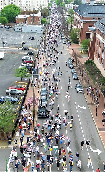 Protesters fill Mainstreet during the “Hands Off!” rally on Saturday, April 6, marching from Capitol Square to Monroe Park in opposition to the influence of President Trump and Elon Musk on politics and civil rights.