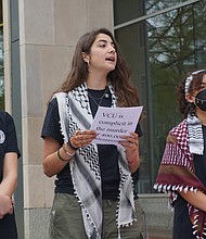 Sereen Haddad, center, speaks during a press conference outside the James Branch Cabell Library last week, joined by fellow VCU students and Students for Justice in Palestine members Cristina Sayegh and Kenza Zitouni.