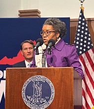 Lt. Gov. Winsome Earle-Sears speaks at a bill-signing event in Richmond on March 19, as Gov. Glenn Youngkin looks on. At the event, both doubled down on the necessity of sweeping federal layoffs while attempting to reassure Virginians that the state’s economy is resilient.