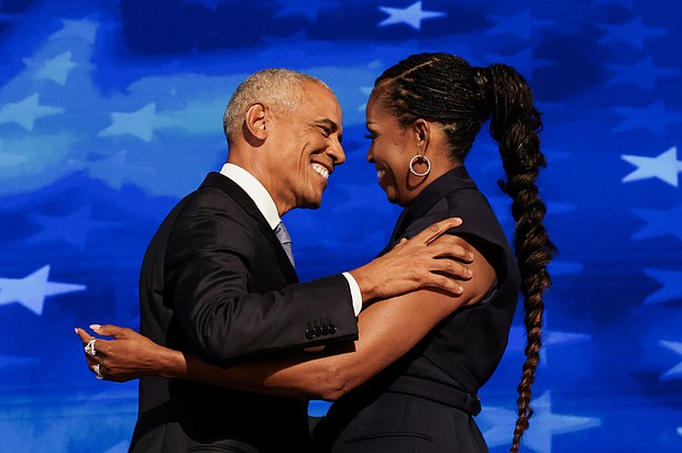 Former U.S. first lady Michelle Obama greets her husband, former U.S. President Barack Obama, on stage during Day 2 of the Democratic National Convention (DNC) in Chicago, Illinois, in August 2024.
Mandatory Credit:	Alyssa Pointer/Reuters via CNN Newsource
