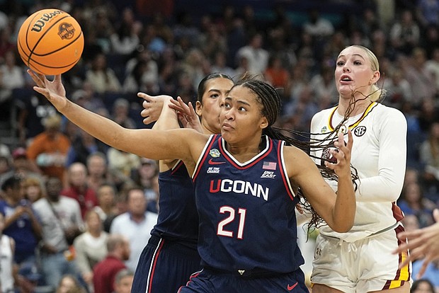 UConn forward Sarah Strong (21) pulls in a rebound against South Carolina during the second half of the national championship game at the Final Four of the women’s NCAA college basketball tournament April 6, in Tampa, Fla.