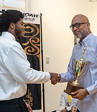 Kendrick Warren, head varsity basketball coach at Thomas Jefferson High School, receives the Dave Robbins Boys Coach of the Year Award during the 2025 Spring Maxie Awards held Saturday, April 5, at the Black History Museum and Cultural Center of Virginia.