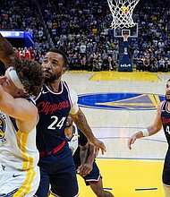 Golden State Warriors guard Brandin Podziemski (2) and Los Angeles Clippers guard Norman Powell (24) compete for a rebound during overtime on Sunday.
Mandatory Credit:	Godofredo A. Vásquez/AP via CNN Newsource
