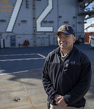 Master Chief Petty Officer Long Lam/Photo by Mass Communication Specialist Seaman Joseph Sitter,
Navy Public Affairs Support Element West
