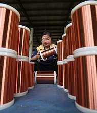 A worker processes copper wire at a workshop in Huai 'an City, East China's Jiangsu Province,  on June 28, 2023.
Mandatory Credit:	CFOTO/Future Publishing/Getty Images via CNN Newsource