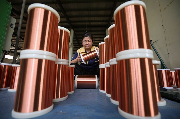 A worker processes copper wire at a workshop in Huai 'an City, East China's Jiangsu Province,  on June 28, 2023.
Mandatory Credit:	CFOTO/Future Publishing/Getty Images via CNN Newsource