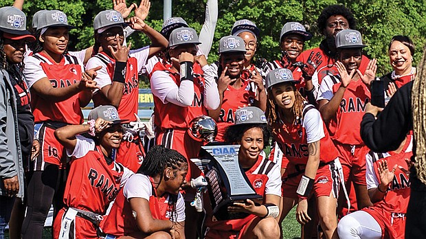Winston-Salem State University players celebrate with the championship trophy after winning the CIAA’s first women’s flag football title April 6 at Johnson C. Smith University in Charlotte. The Rams defeated Fayetteville State 9-6 in the final.