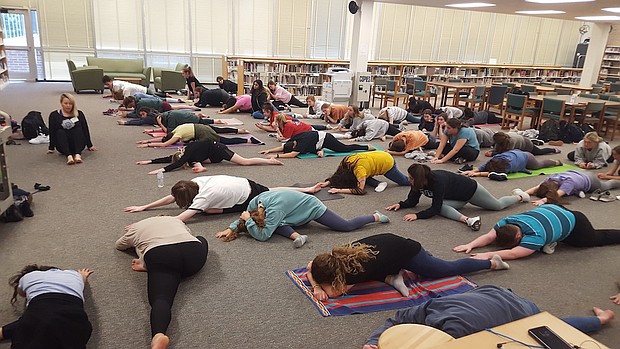 People doing yoga in Stratford.