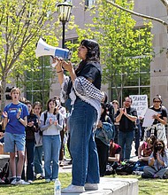 Fern, a community advisor with Students for Justice in Palestine at VCU, spoke April 4 at VCU’s Park Plaza during the “Hands Off Our Students Walkout” in response to international students having their visas revoked.