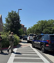 Law enforcement vehicles are stationed outside of Florida State University’s student union building after a shooting on the university campus on Thursday.
Mandatory Credit:	Kate Payne/AP via CNN Newsource