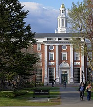 People walk on the business school campus of Harvard University in Cambridge, Massachusetts, on April 15.
Mandatory Credit:	Faith Ninivaggi/Reuters via CNN Newsource