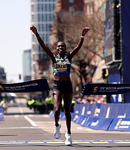 Lokedi sets a new course record at the Boston Marathon.
Mandatory Credit:	Maddie Meyer/Getty Images via CNN Newsource