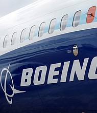 The Boeing logo is seen on the side of a Boeing 737 MAX at the Farnborough International Airshow in Farnborough, Britain, on July 20, 2022.
Mandatory Credit:	Peter Cziborra/Reuters via CNN Newsource