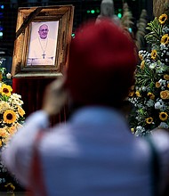 A mourner looks upon a portrait of the late Pope Francis at the Rio de Janeiro Metropolitan Cathedral, in Brazil, on April 21. The funeral for the 88-year-old pontiff will take place at the Vatican, on Saturday.
Mandatory Credit:	Buda Mendes/Getty Images via CNN Newsource