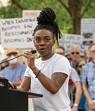 Diversity Richmond Program Director Quing Imzadi spoke to a crowd of demonstrators Saturday, April 19, at Capitol Square during the “Freedom Rising” rally.