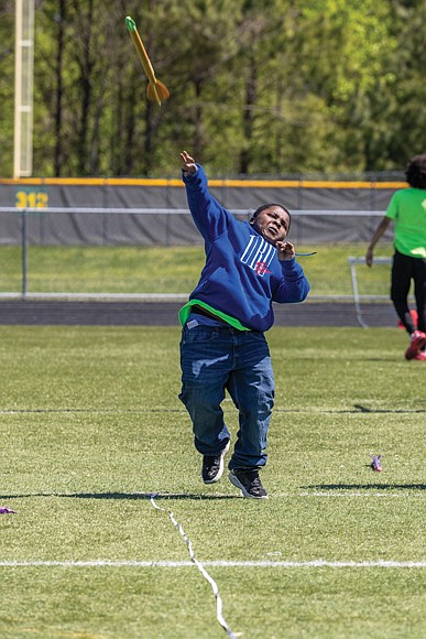 With focus and power, Kamar — a sixth grader at Martin Luther King Jr. Middle School - launches the javelin during competition.