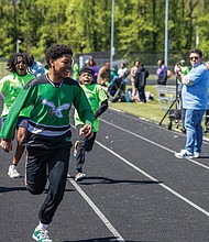 Thomas H. Henderson Middle School seventh-and eighth-graders Tyion (front left), Aiden (front right), Karell, Judah and Micah (back left to right) compete in the 50-meter race.