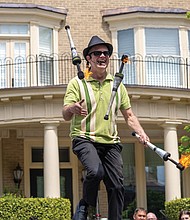 Jonathan Austin brings back his juggling act with flaming torches on a unicycle.