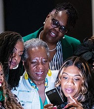 Women snap a selfie after a group activity at Virginia Credit Union’s Financial Success for Women Summit on April 15.