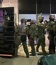 Drug Enforcement Administration agents, along with about 300 other local and federal agents and officers, broke up a party and arrested over 100 people who federal officials say are undocumented immigrants in Colorado Springs early on the morning of  April 27.
Mandatory Credit:	KCNC/U.S. Attorney General Pam Bondi via CNN Newsource