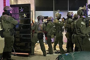 Drug Enforcement Administration agents, along with about 300 other local and federal agents and officers, broke up a party and arrested over 100 people who federal officials say are undocumented immigrants in Colorado Springs early on the morning of  April 27.
Mandatory Credit:	KCNC/U.S. Attorney General Pam Bondi via CNN Newsource