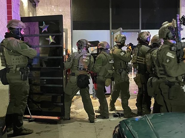 Drug Enforcement Administration agents, along with about 300 other local and federal agents and officers, broke up a party and arrested over 100 people who federal officials say are undocumented immigrants in Colorado Springs early on the morning of  April 27.
Mandatory Credit:	KCNC/U.S. Attorney General Pam Bondi via CNN Newsource