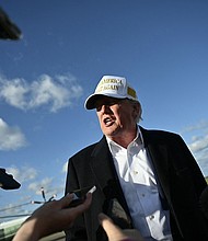 President Donald Trump speaks to reporters before boarding Air Force One.
Mandatory Credit:	Mandel Ngan/AFP/Getty Images via CNN Newsource