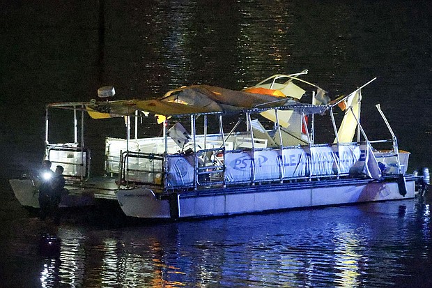 Investigators search the wreckage of a Clearwater ferry after a boat crashed into it, causing multiple injuries near the Clearwater Memorial Causeway Bridge on Sunday.
Mandatory Credit:	Douglas R. Clifford/Tampa Bay Times/AP via CNN Newsource