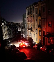 Street lighting went out in Lisbon, leaving drivers to cautiously inch home.
Mandatory Credit:	Armando Franca/AP via CNN Newsource