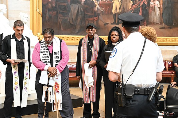 Prominent pastor and anti-poverty activist the Rev. William Barber and two others were arrested while praying in the U.S. Capitol … Prominent pastor and anti-poverty activist the Rev. William Barber and two others were arrested while praying in the U.S. Capitol …