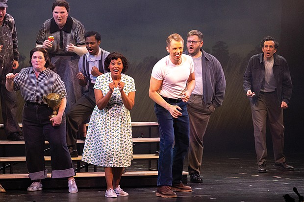 Flora Hawk as Mildred Jeter Loving and Jonathan Michie as Richard Loving share a powerful moment on stage, joined by members of the chorus, in a scene from the world premiere production of “Loving v. Virginia.”