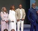 Bishop T.D. Jakes, right, speaks at The Potter’s House with his wife Serita, from left, daughter, Sarah Jakes Roberts, and her husband, Touré Roberts, Sunday, April 27, in Dallas.